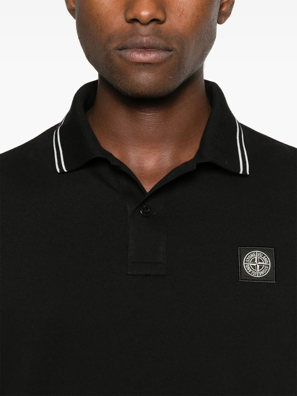 Close up of Black shirt, showing texture of the cotton fabric