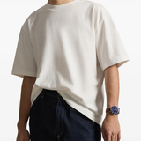 White t-shirt worn by a person, showing the t-shirt fit