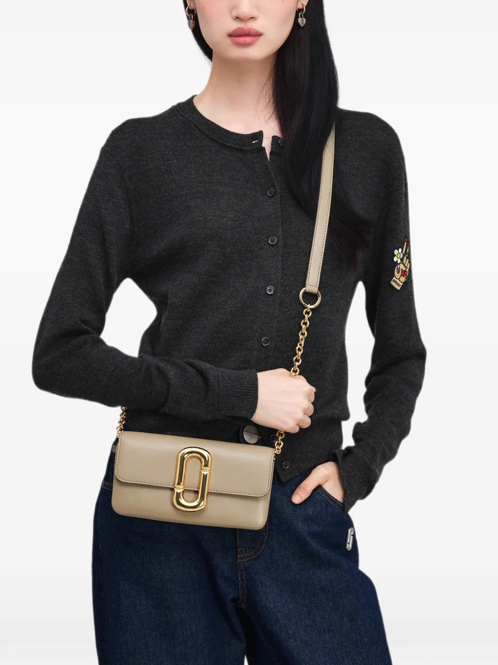 Tan accessories worn by a person, showing the accessories fit