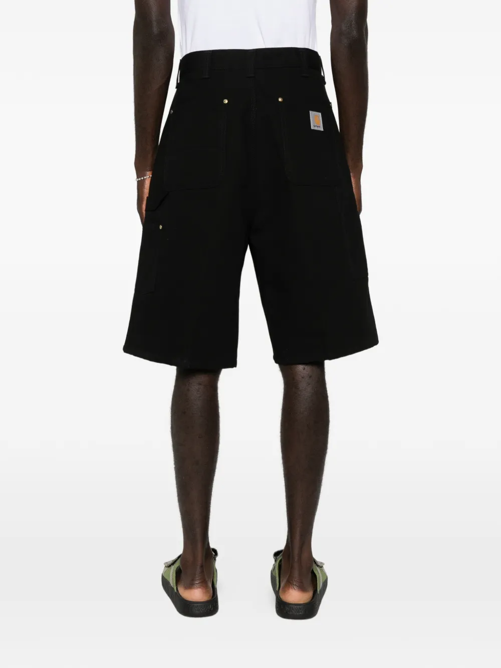 black short worn by a person, showing the short fit