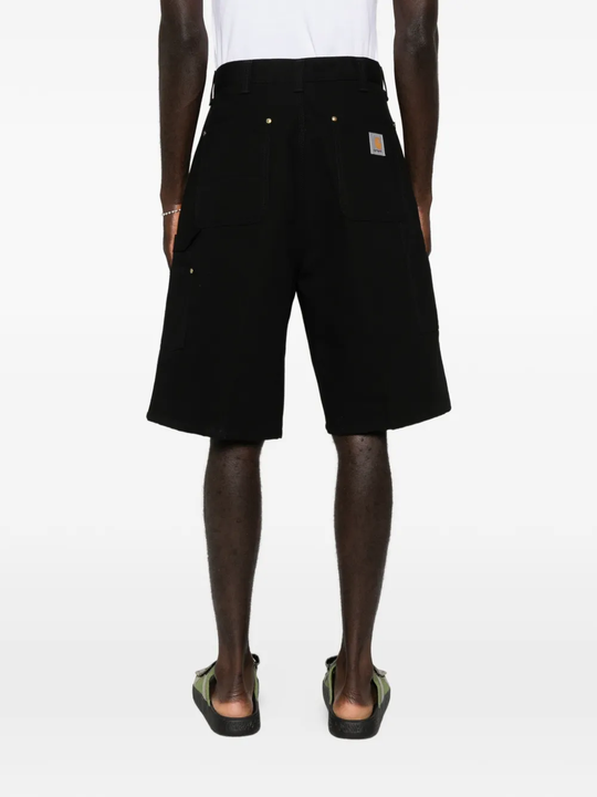 black short worn by a person, showing the short fit