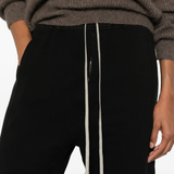Close up of black pants , showing texture of the cotton fabric