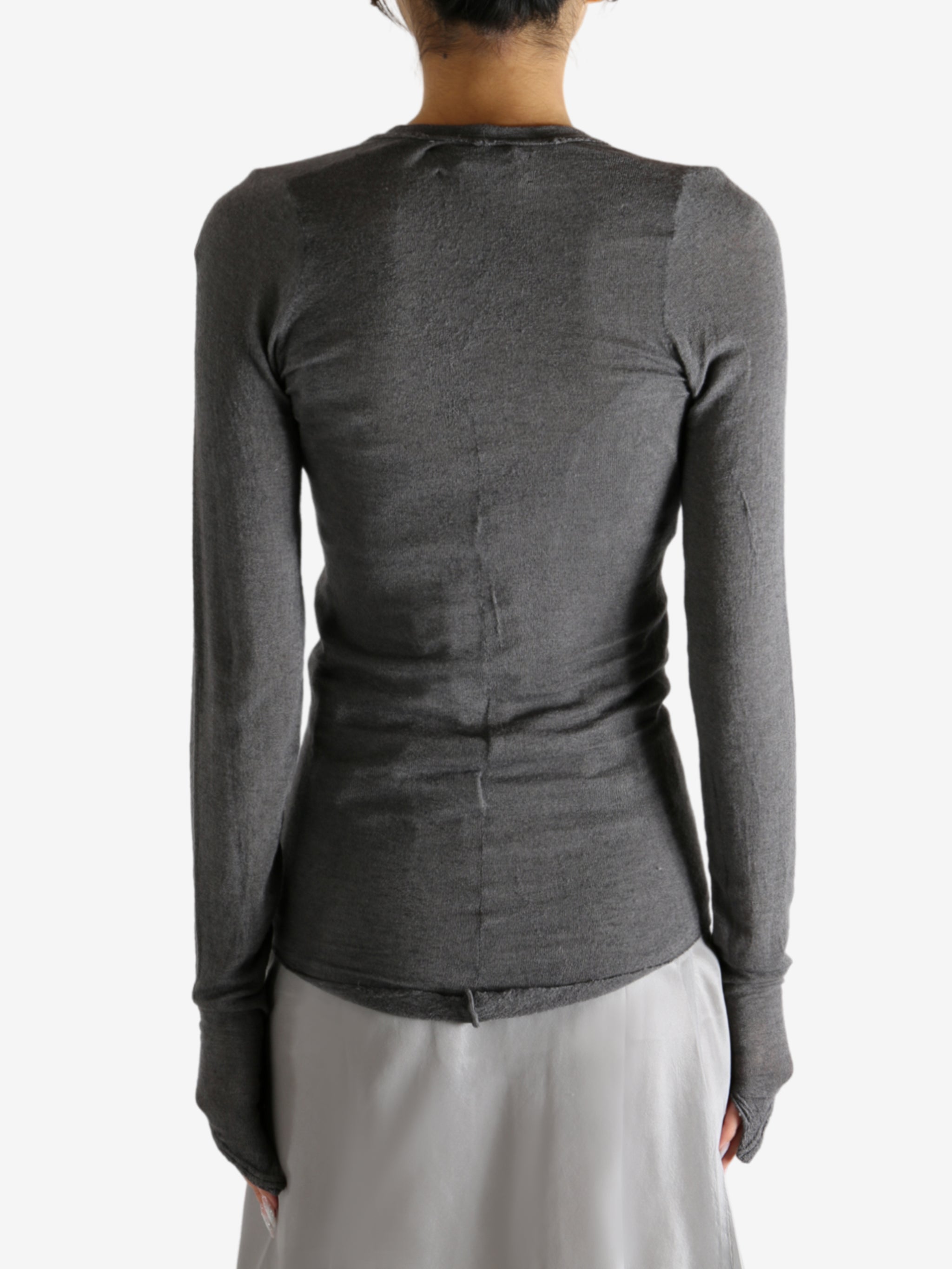 Grey t-shirt worn by a person, showing the shirt's fit