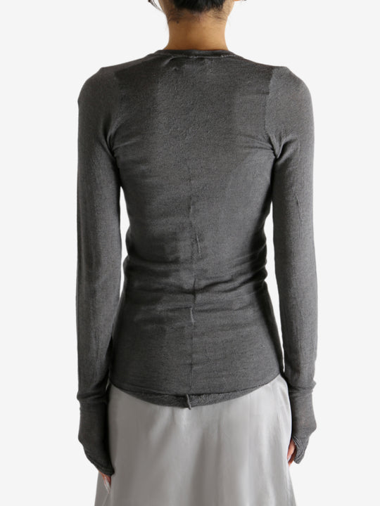 Grey t-shirt worn by a person, showing the shirt's fit