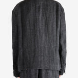 Black shirt worn by a person, showing the shirt's fit