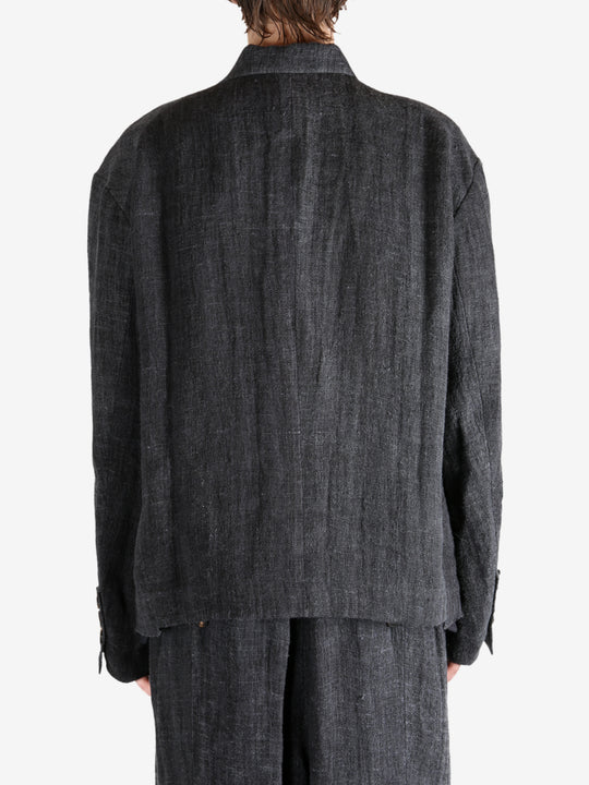 Black shirt worn by a person, showing the shirt's fit