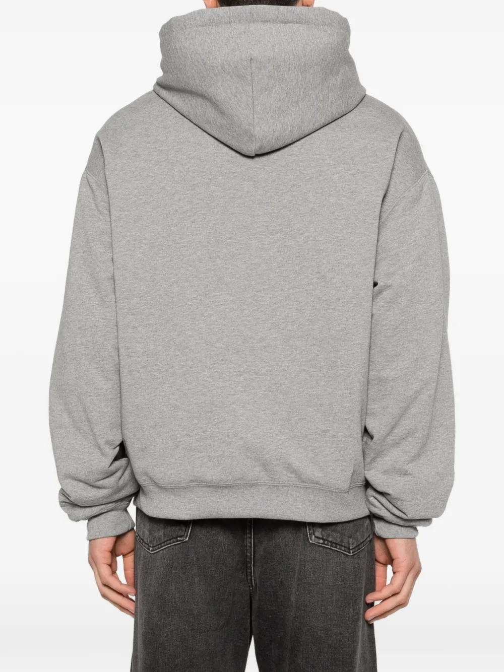 Grey hoodie worn by a person, showing the hoodie fit