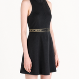 Black dress worn by a person, showing the dress fit