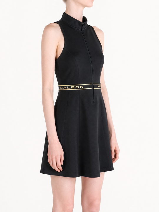 Black dress worn by a person, showing the dress fit