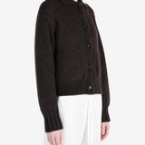 Brown knitwear worn by a person, showing the knitwear fit