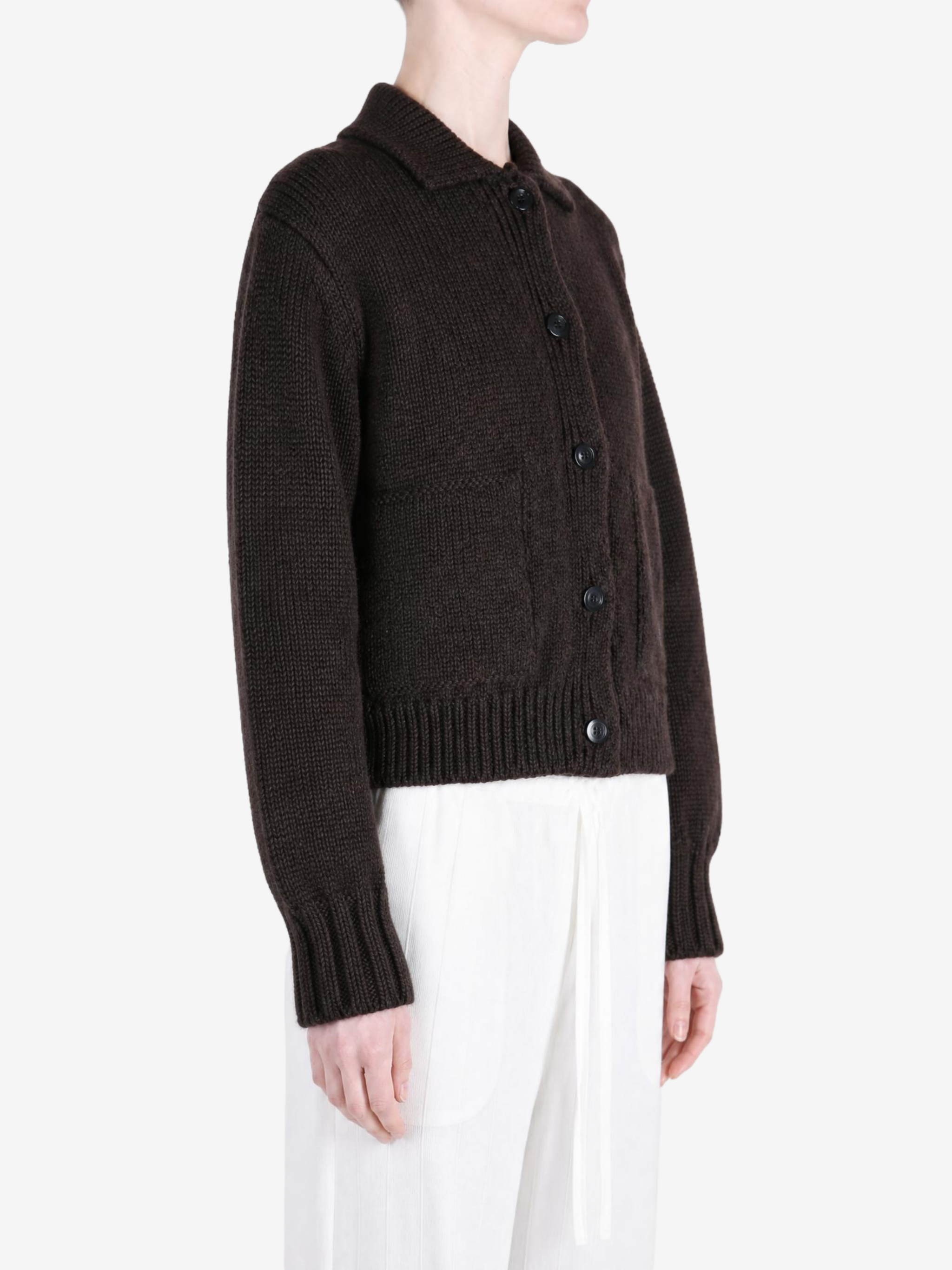 Brown knitwear worn by a person, showing the knitwear fit