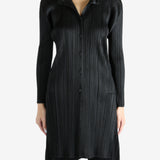 Black shirt worn by a person, showing the shirt's fit