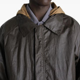 Close up of brown jacket showing texture of the cotton fabric