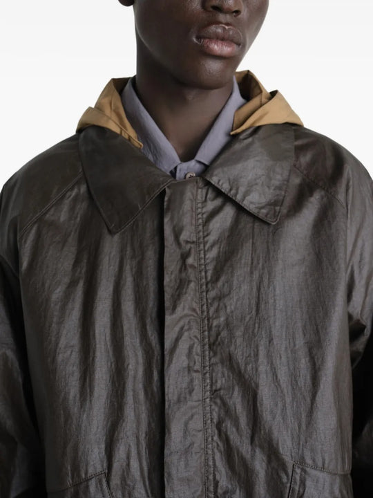 Close up of brown jacket showing texture of the cotton fabric