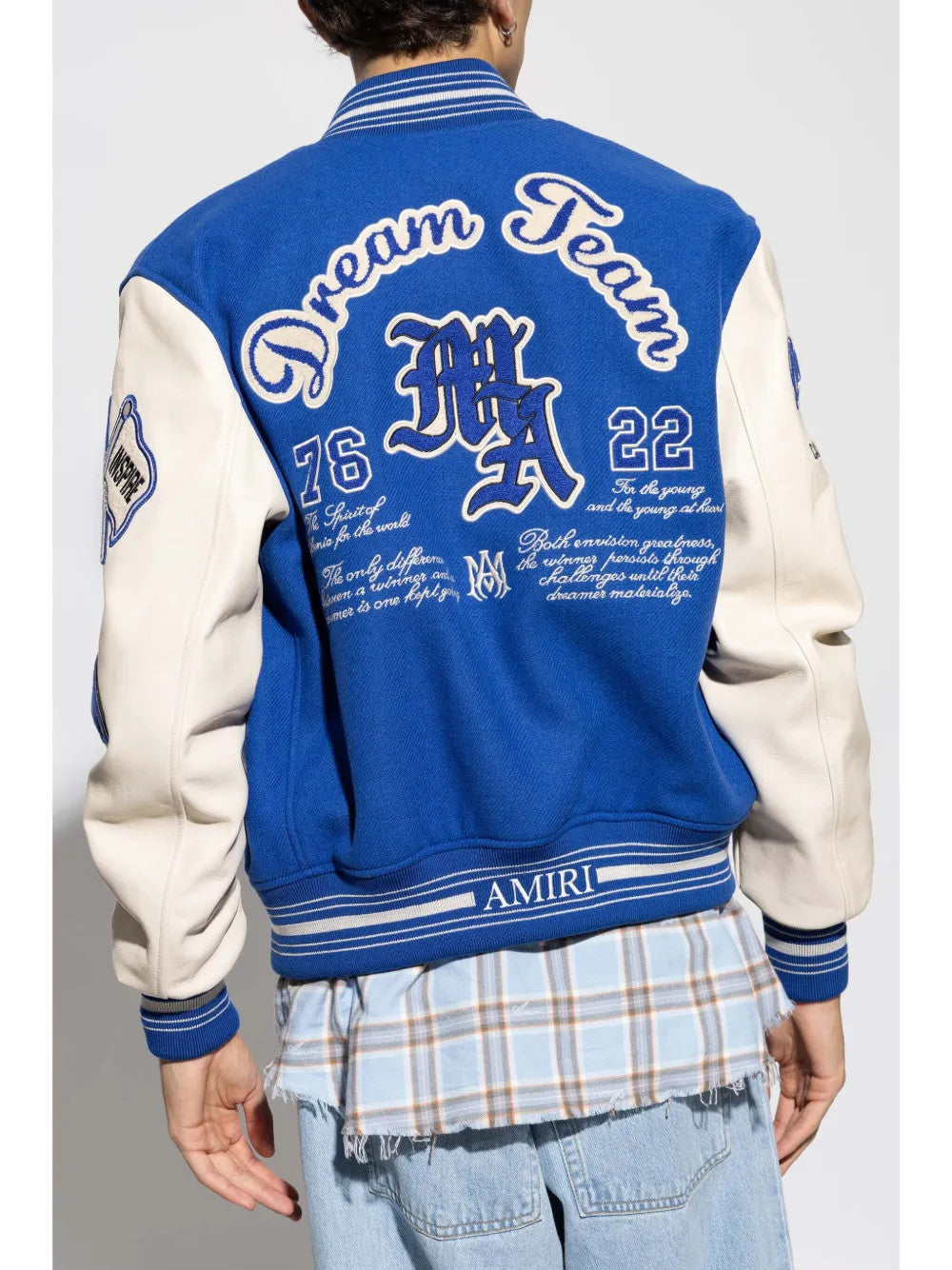 Blue jacket worn by a person, showing the jacket fit