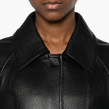 Close up of black coat,showing texture of the leather fabric