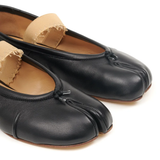 Close up of the black flat, showing texture of the leather fabric