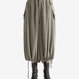 Tan pants worn by a person, showing the pants fit