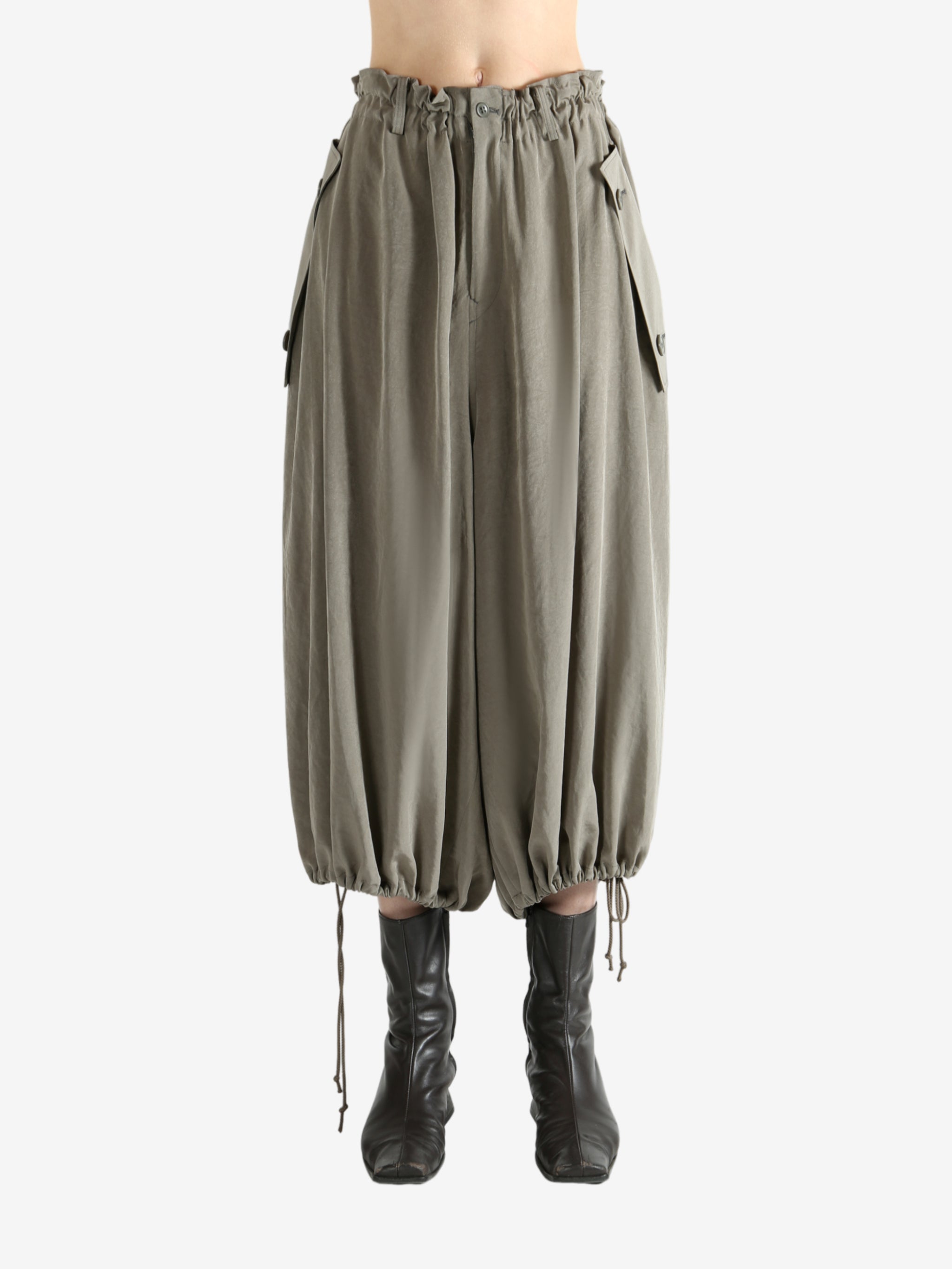 Tan pants worn by a person, showing the pants fit