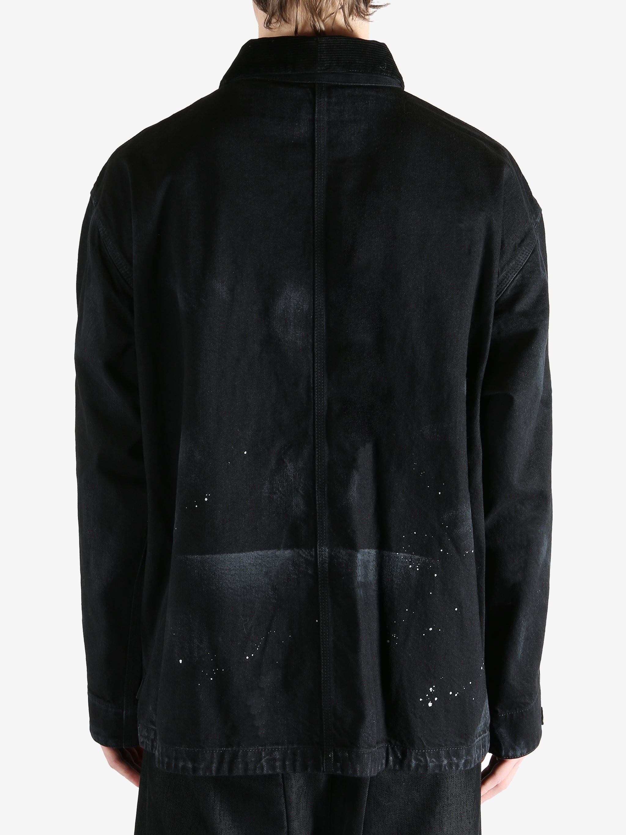 Black jackets worn by a person, showing the jackets fit