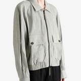 Grey jacket worn by a person, showing the jacket fit