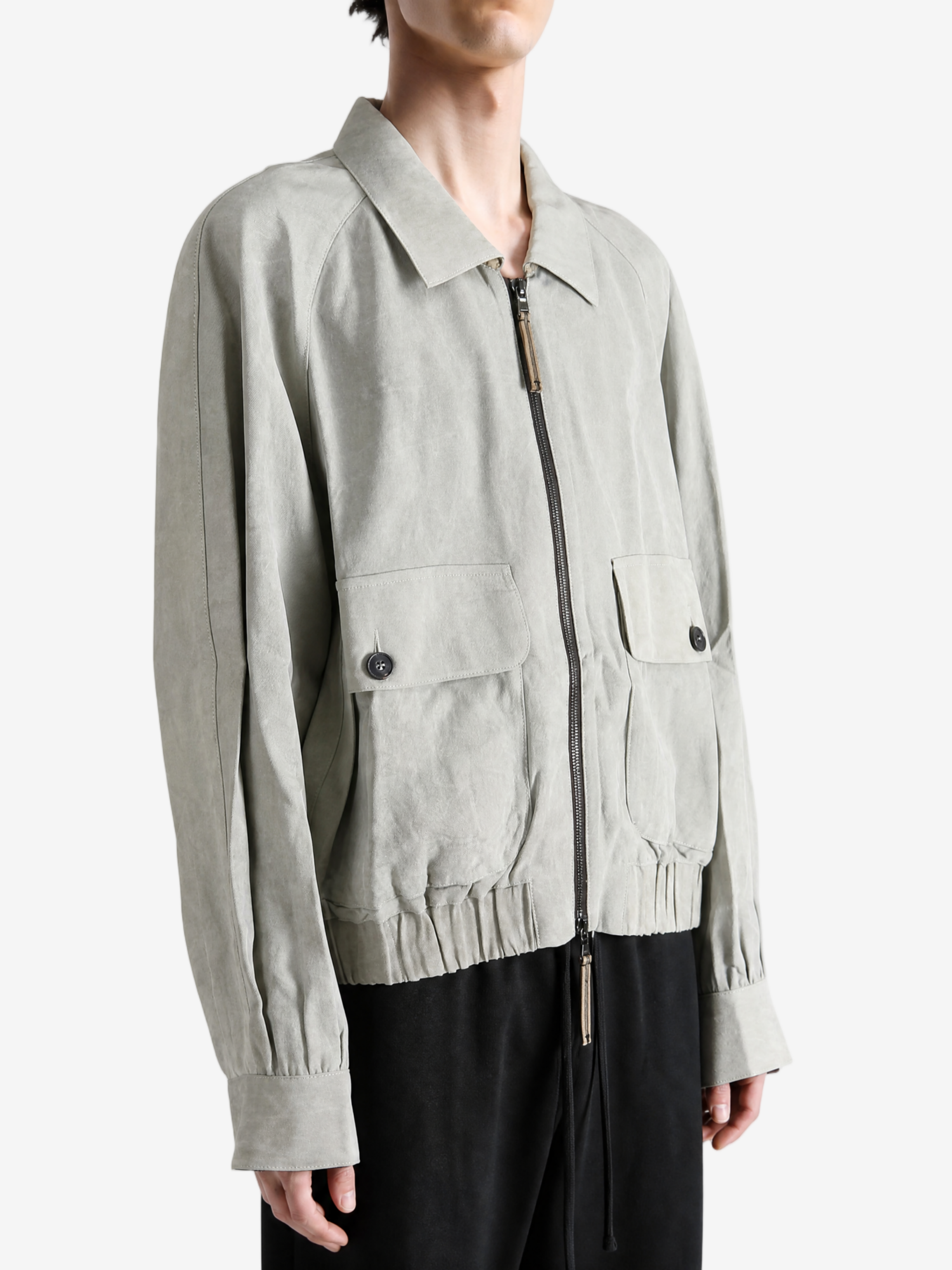 Grey jacket worn by a person, showing the jacket fit
