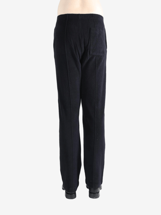 Navy pants worn by a person, showing the pants fit