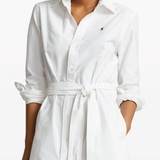 White shirtdress worn by a person, showing the shirtdress's fit