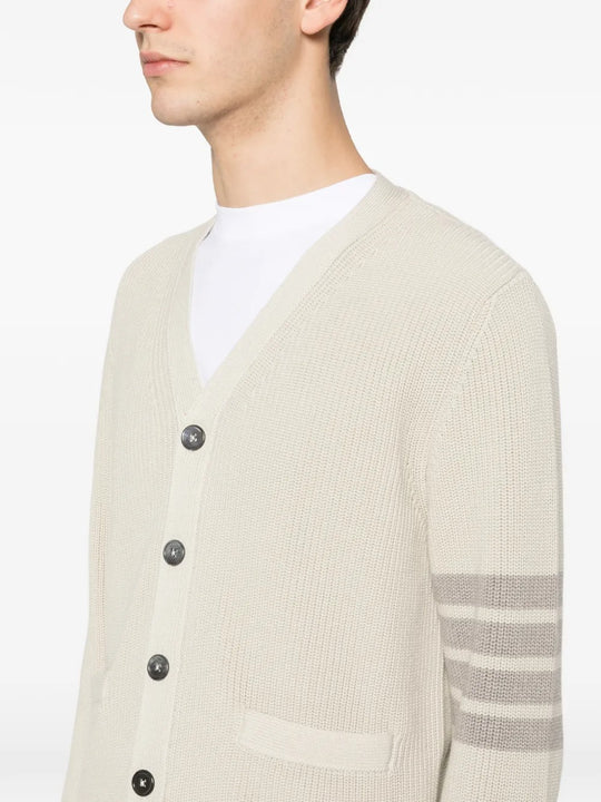 Close up of white cardigan, showing texture of the cotton fabirc