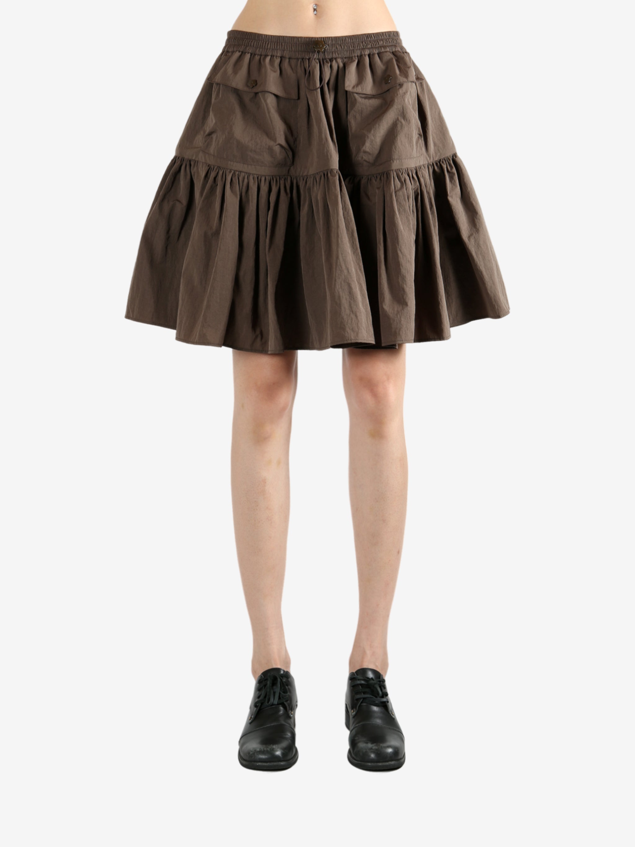 Brown skirt worn by a person, showing the skirt's fit