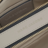 close up of grey  bags, showing texture of the leather fabric