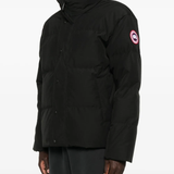 Black jacket worn by a person, showing the jacket fit