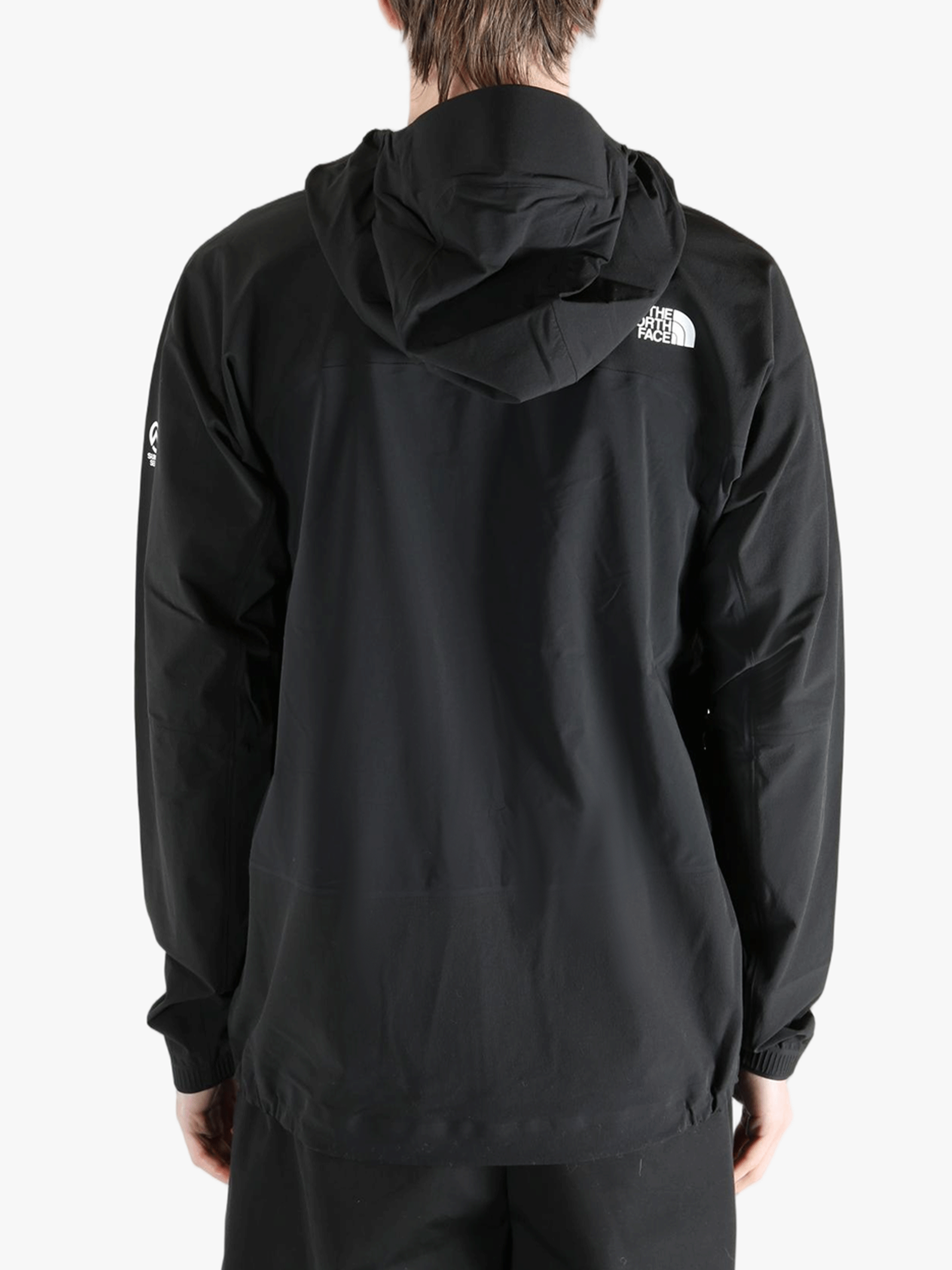 Black jacket worn by a person, showing the jacket's fit