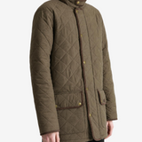 Green jacket worn by a person, showing the jacket fit