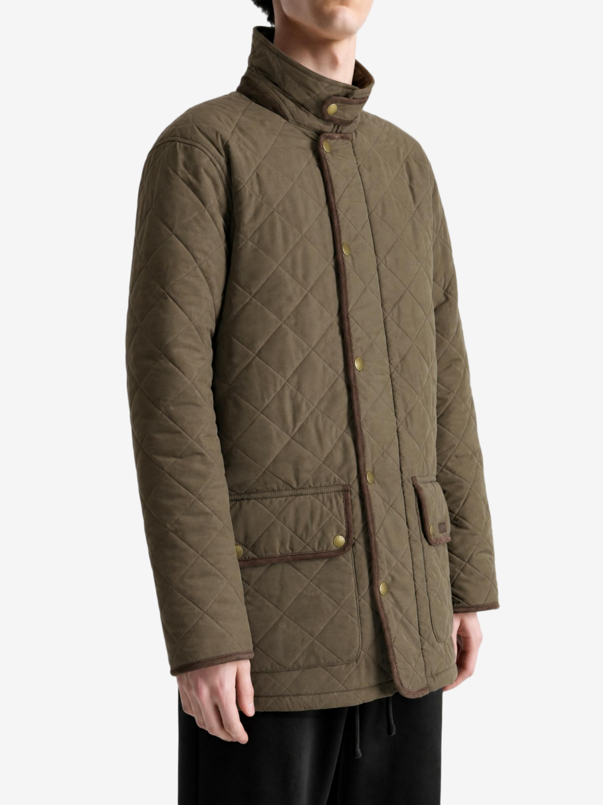 Green jacket worn by a person, showing the jacket fit