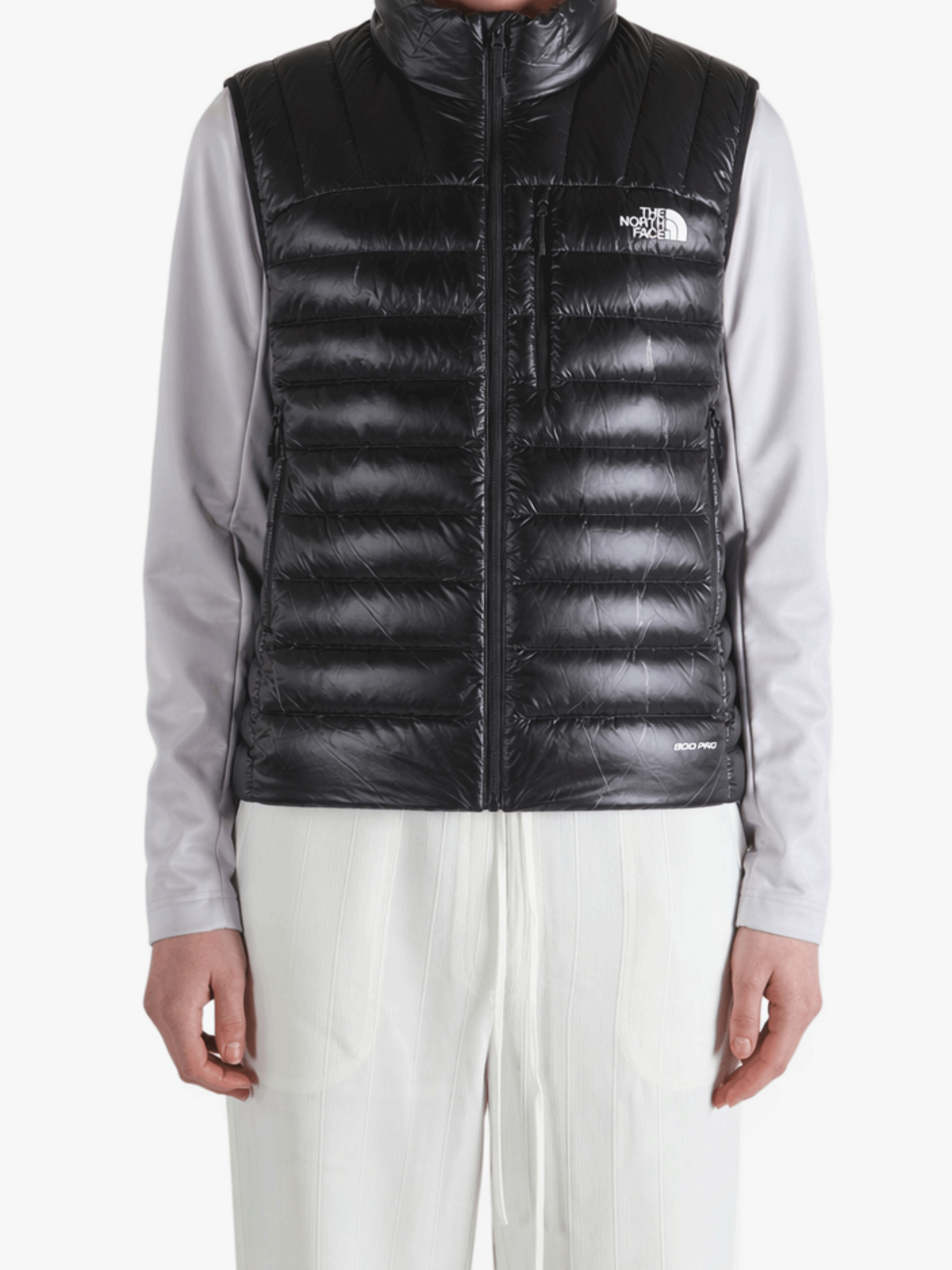 Black coats worn by a person, showing the coats fit