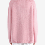 Pink knitwear, full body view