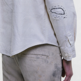 White shirt worn by a person, showing the shirt fit
