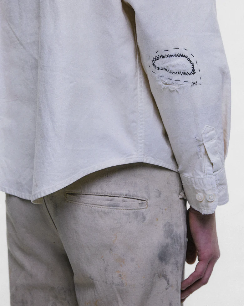 White shirt worn by a person, showing the shirt fit