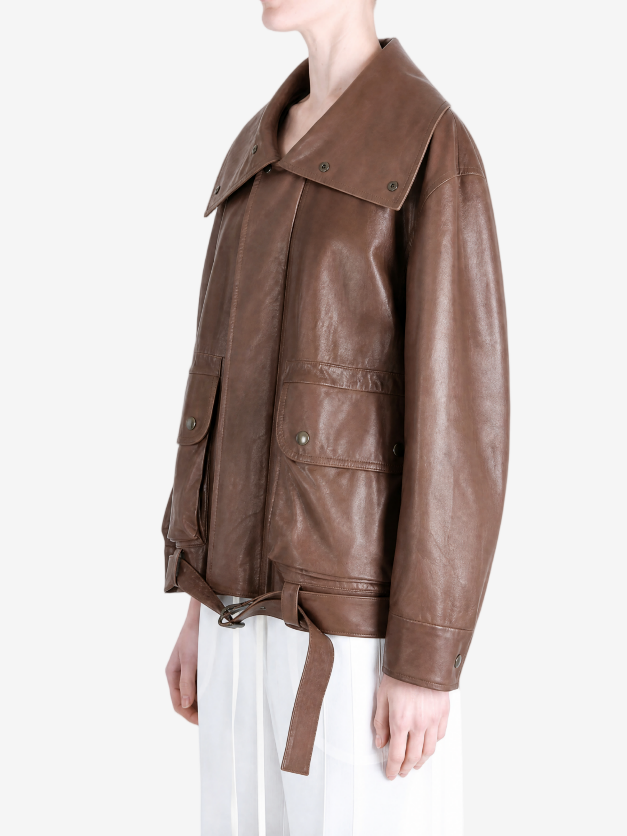 Brown jacket worn by a person, showing the jacket fit