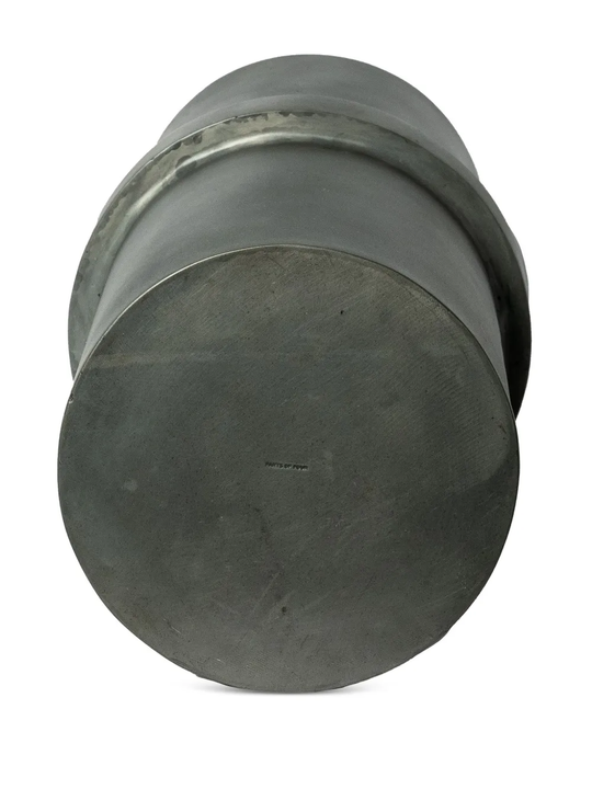 Close up of the grey vase, showing texture of the iron