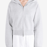 Grey hoodie worn by a person, showing the hoodie fit