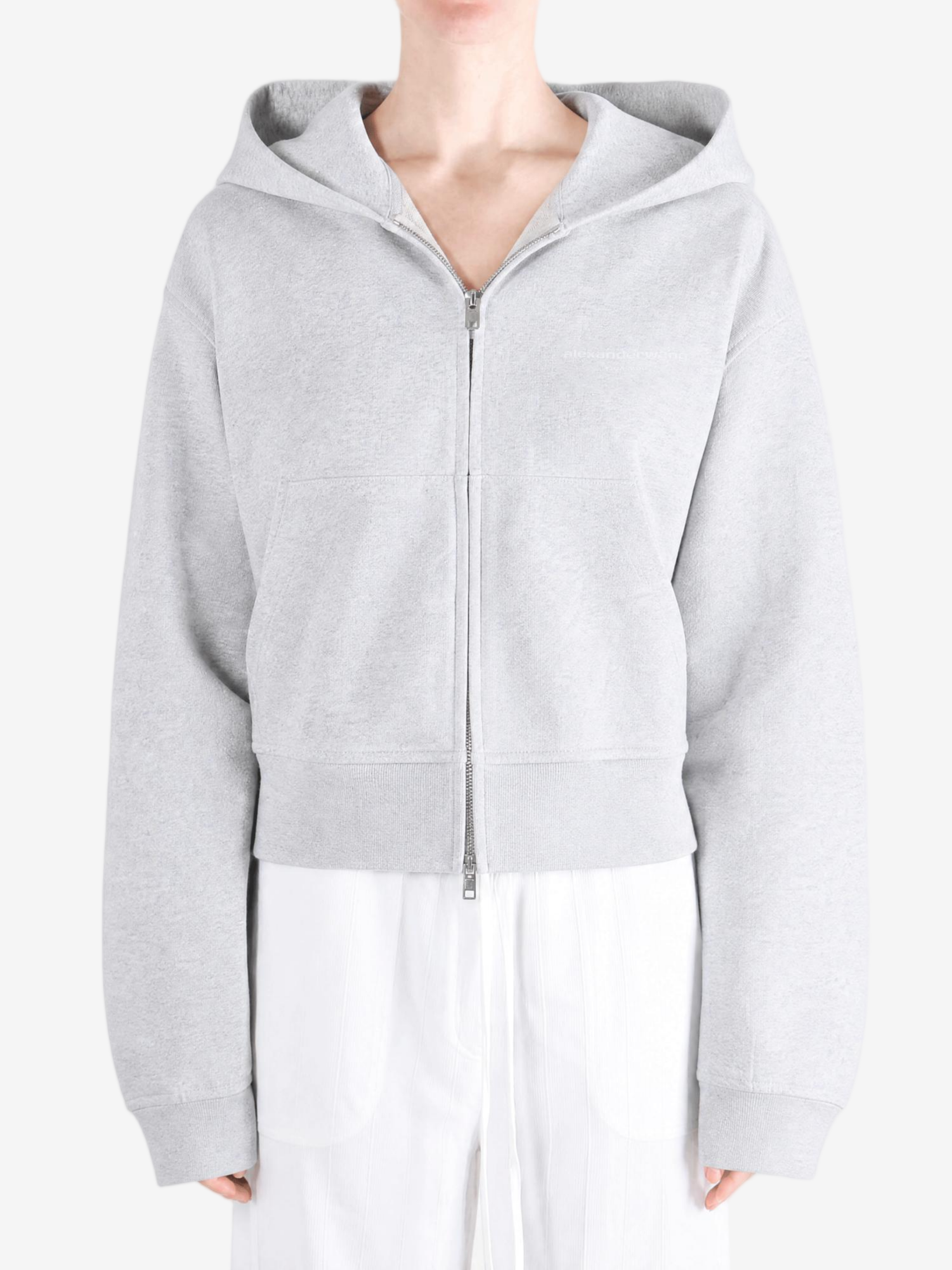 Grey hoodie worn by a person, showing the hoodie fit