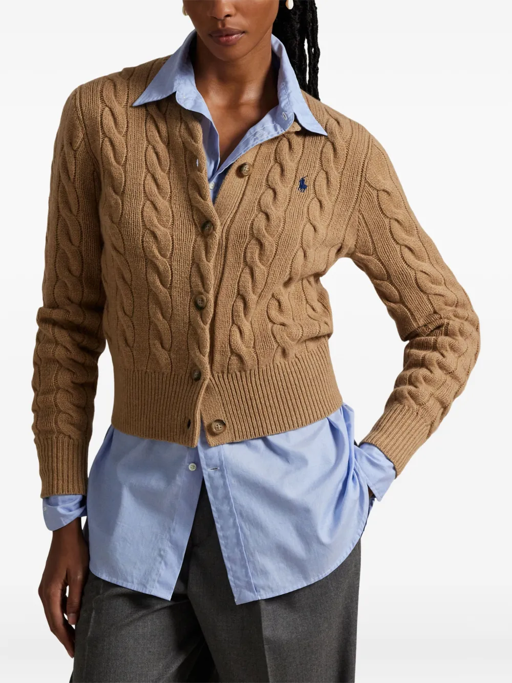 Brown cardigan worn by a person, showing the cardigan's fit