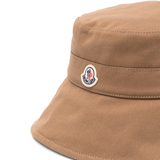 Close up of tan hat, showing texture of the cotton fabric