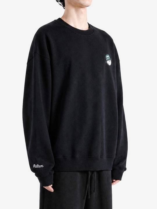 Black hoodie worn by a person, showing the hoodie fit