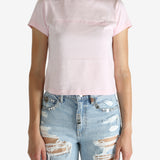 Pink t-shirt worn by a person, showing the shirt's fit