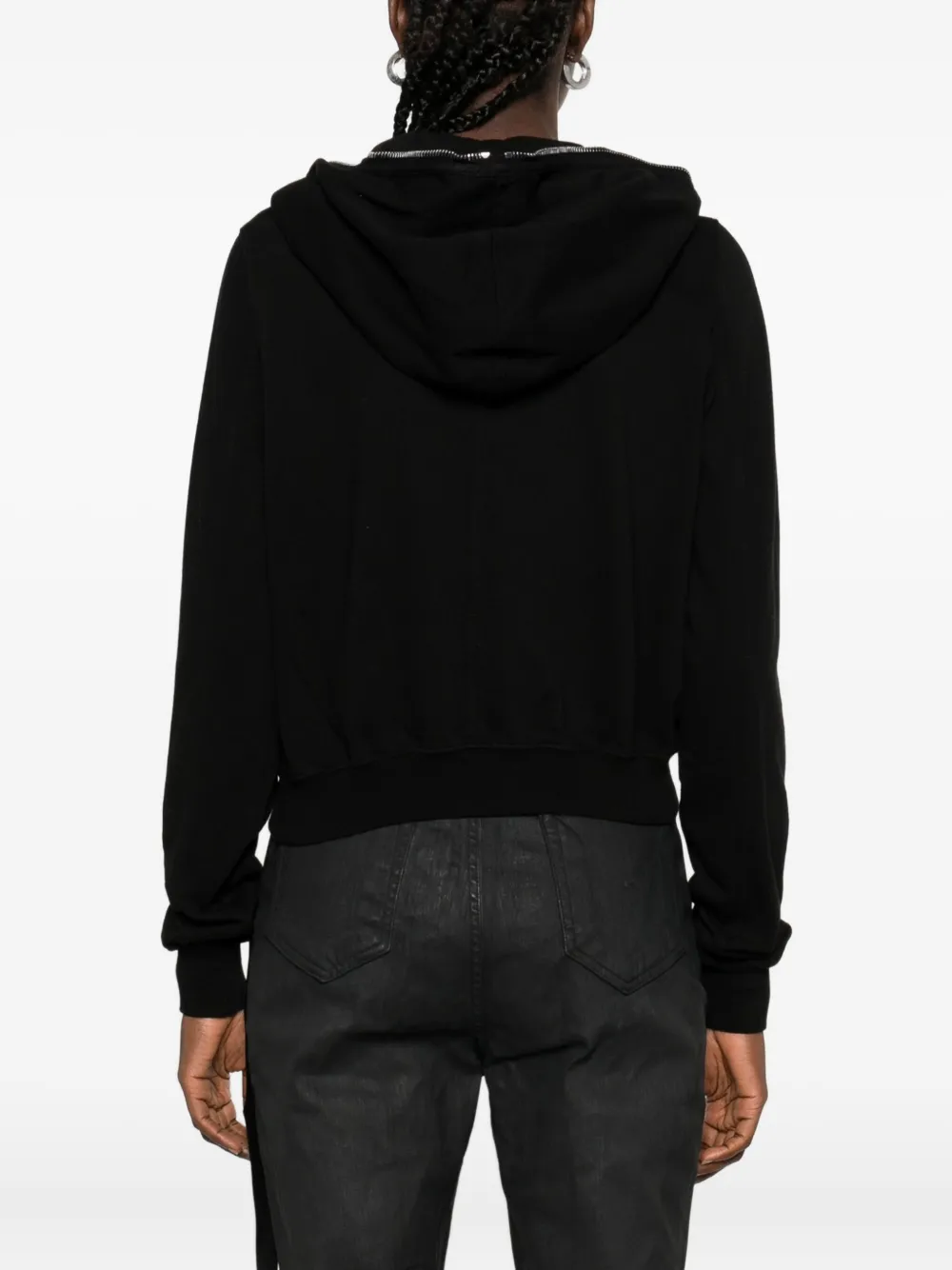 Black hoodie worn by a person, showing the hoodie's fit