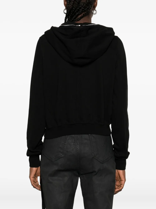 Black hoodie worn by a person, showing the hoodie's fit