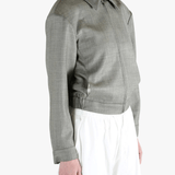 Grey jacket worn by a person, showing the jacket fit